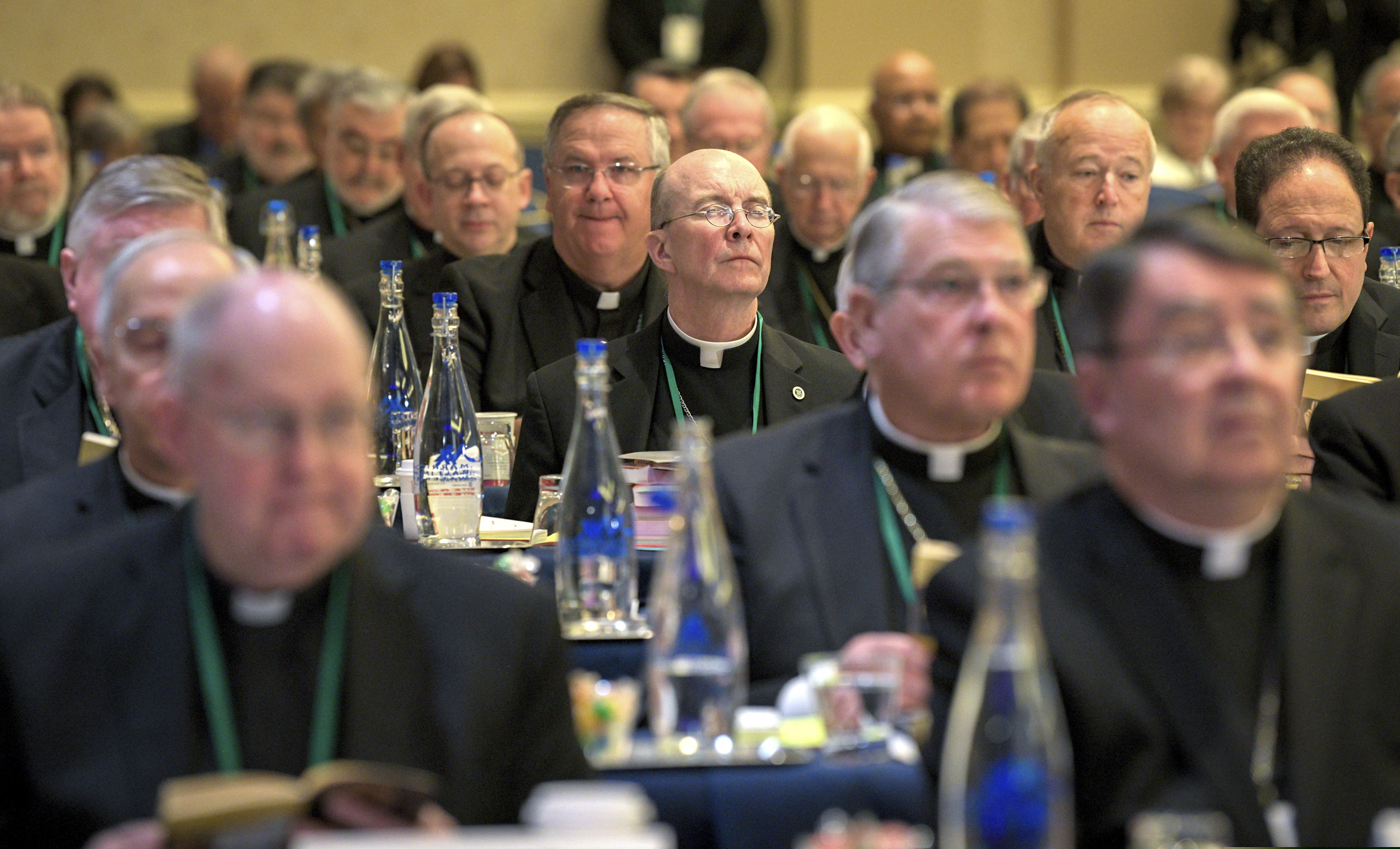 (Jerry Jackson | The Baltimore Sun via AP) Bishops are seated during the opening moments of the United States Conference of Catholic Bishops Fall General Assembly at the Baltimore Marriott Waterfront Monday, Nov. 11, 2019.