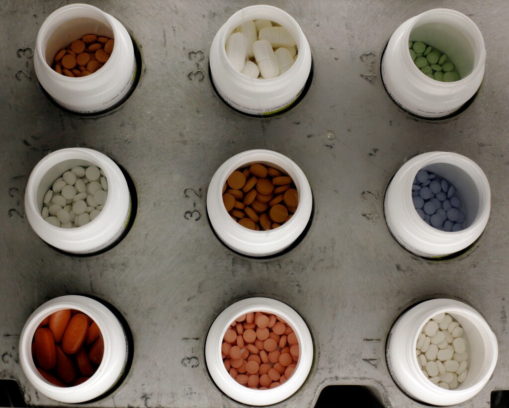 FILE - In this June 14, 2011 file photo, various prescription drugs on the automated pharmacy assembly line at Medco Health Solutions in Willingboro, N.J. A safeguard for Medicare beneficiaries has become a way for drugmakers to get paid billions of dollars for pricey medications at taxpayer expense, government numbers show. The cost of Medicare’s “catastrophic” prescription coverage jumped by 85 percent in three years, from $27.7 billion in 2013 to $51.3 billion in 2015, according to the program’s number-crunching Office of the Actuary.  (AP Photo/Matt Rourke, File)