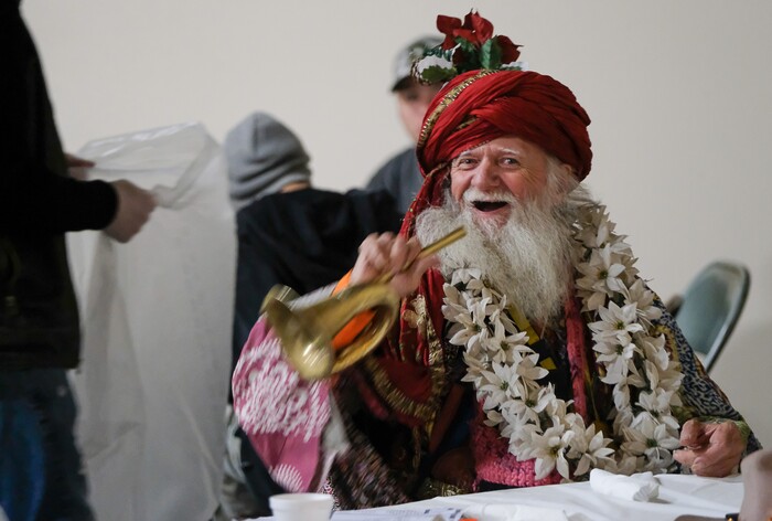 (Francisco Kjolseth | The Salt Lake Tribune) Conde Kieateen Teargon, 70, toots a horn as he gets breakfast at the Salt Lake City Mission at 1055 North Redwood Road in Salt Lake City, on Thanksgiving morning on Thursday, Nov. 28, 2019.