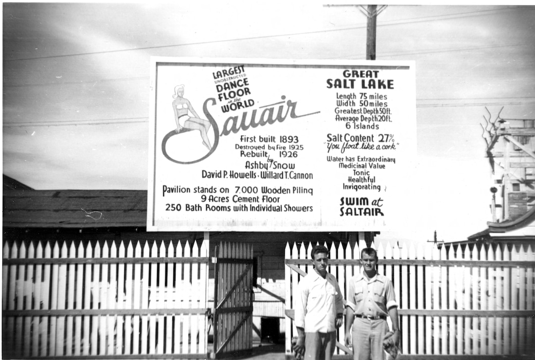 (Utah State Historical Society) Two visitors at the Saltair II Pavilion pose for photographs. Saltair II with its many attractions, bowling alleys, rollercoaster, merry-go-round, ferris wheel and midway games closed in 1958.