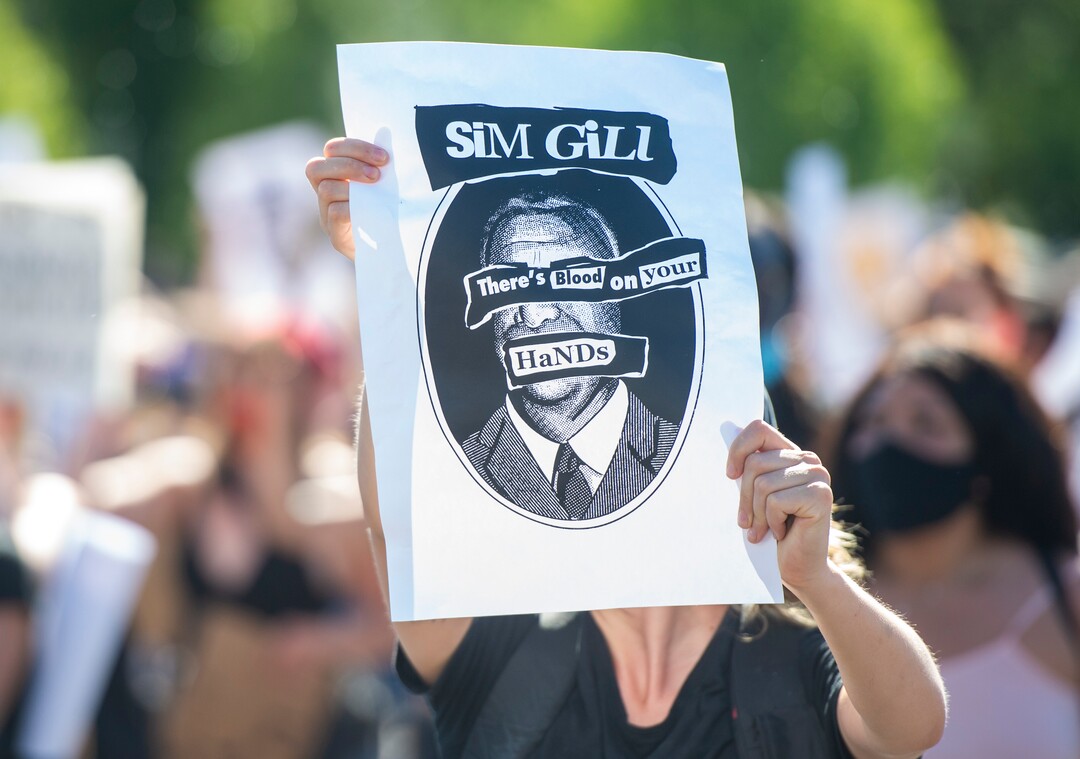 (Rick Egan  |  The Salt Lake Tribune)     Protesters hold signs as they march up Sunnyside Ave, during a march for Justice on Sunday, July 12, 2020.