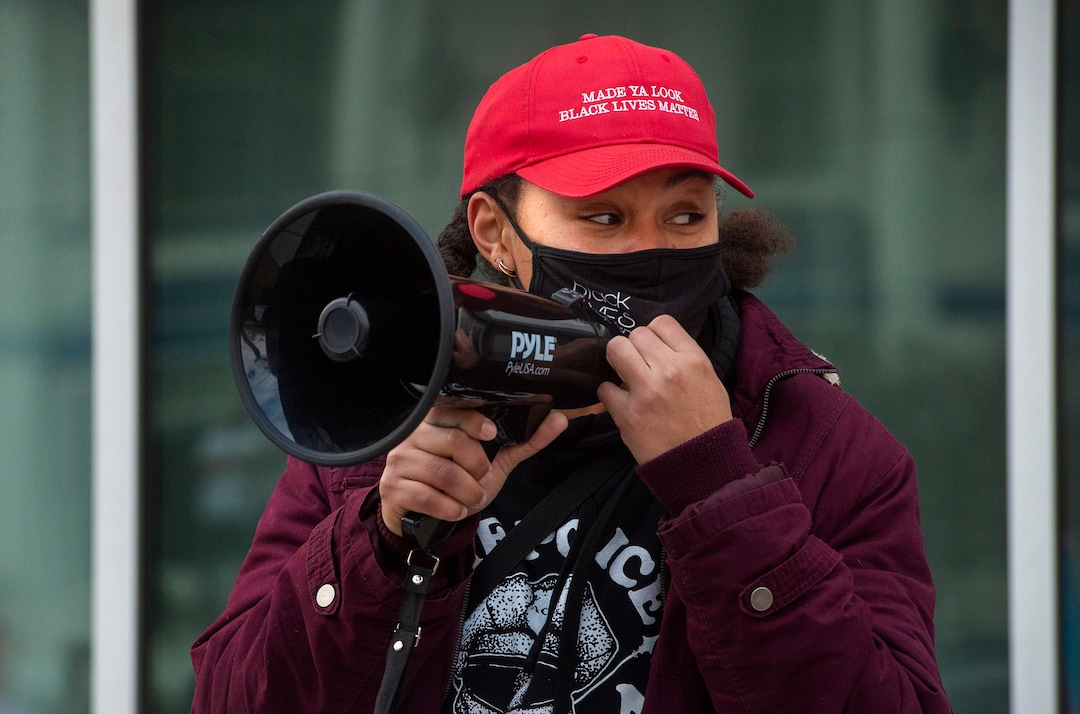 (Rick Egan | The Salt Lake Tribune) Rae Duckworth joins Black Lives Matter, and a group of more than 100 homeless advocates to protest the way the health department has been forcing people experiencing homelessness to move in the middle of a pandemic and the coldest time of the year, in front of the Salt Lake Public Health Center on Friday, Dec. 18, 2020.