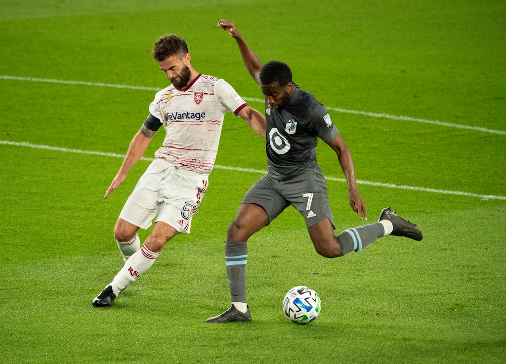 Minnesota United midfielder Kevin Molino (7) shoots the ball while defended by Real Salt Lake midfielder Kyle Beckerman (5) during the first half of an MLS soccer game, Sunday, Sept, 6, 2020 in St. Paul, Minn. (Jeff Wheeler/Star Tribune via AP)