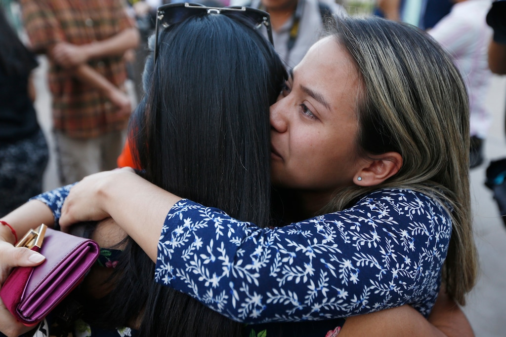 (Ross D. Franklin | The Associated Press) Liz Luna, right, hugs Norma Jimenez as they react to the Arizona Supreme Court ruling against young immigrants granted deferred deportation status under the 2012 Deferred Action for Childhood Arrivals program, during a demonstration at the Arizona Capitol in Phoenix on Monday, April 9, 2018. Immigrants under the program are not eligible for lower in-state college tuition, the supreme court ruled Monday.