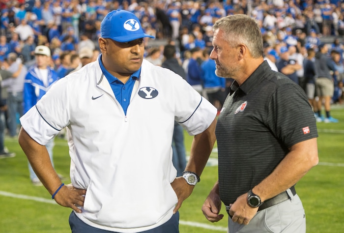 (Rick Egan  |  The Salt Lake Tribune)  Brigham Young Cougars head coach Kalani Satike chats with Utah Utes head coach Kyle Whittingham before the big game at Lavell Edwards Stadium in Provo, Saturday, September 9, 2017.