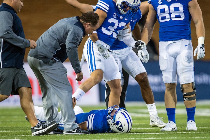 (Chris Detrick  |  The Salt Lake Tribune)  Brigham Young Cougars quarterback Beau Hoge (7) remains on the ground after being tackled during the game at Merlin Olsen Field at Maverik Stadium Friday, September 29, 2017.