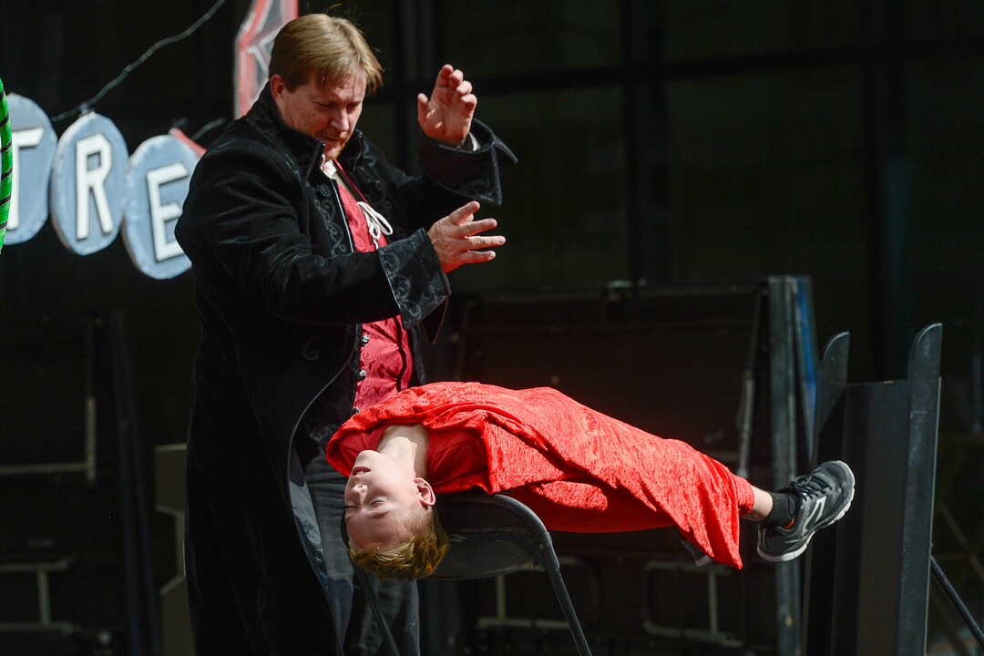 (Francisco Kjolseth  |  The Salt Lake Tribune)  Canyon Nash, 9, finds himself levitated by Gypsy Majick's Eric Wanner as the Salt Lake Arts Council presents the first Busker Fest, featuring entertainers, dancers, musicians, magicians, jugglers, and comedy to celebrate the tradition of street performance and observe the city's vaudeville roots along Regent Street in downtown Salt Lake City on Friday, Aug. 24, 2018.