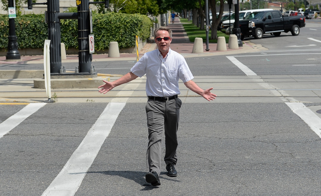(Francisco Kjolseth  |  The Salt Lake Tribune)  Salt Lake Tribune editor Dave Noyce finishes his race against colleagues after using his own two feet in a transportation race from Library Square to the Tribune building at the Gateway on Thursday, Aug. 2, 2018. Modes of transportation included, rentable electric scooters, Green Bike, TRAX, Lyft, and walking.