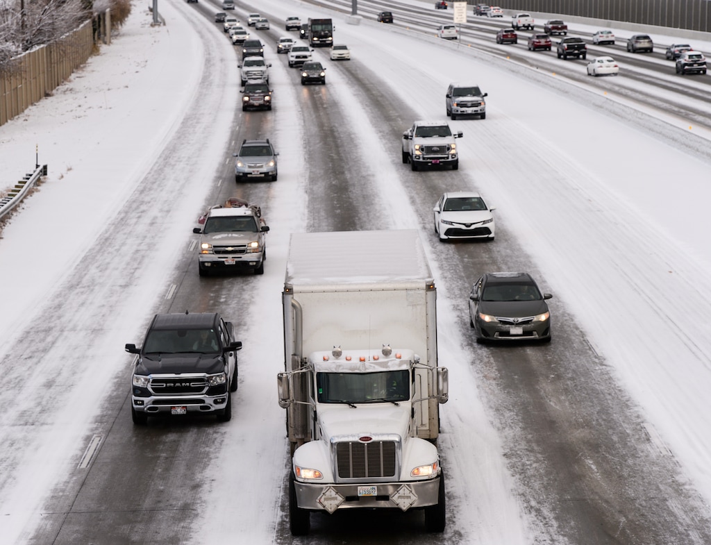 (Chris Samuels | The Salt Lake Tribune) Morning snow slows down traffic along I-215 in West Valley City, Friday, Dec. 10, 2021. On Sunday morning, a snow squall brought more snow, intense winds and travel delays for Utahns.