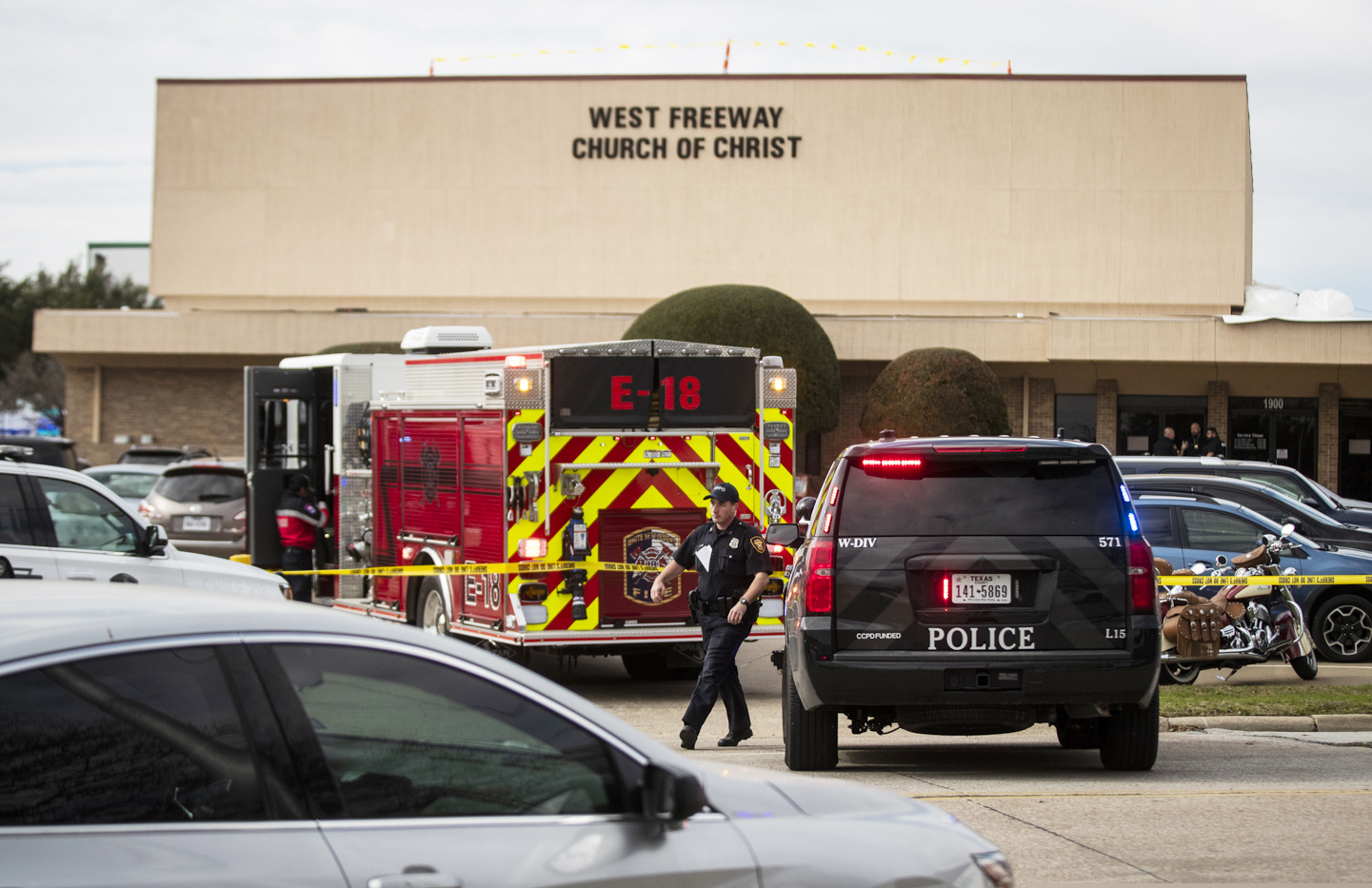 (Yffy Yossifor | Star-Telegram via AP)  Police and fire departments surround the scene of a shooting at West Freeway Church of Christ in White Settlement, Texas, Sunday, Dec. 29, 2019.