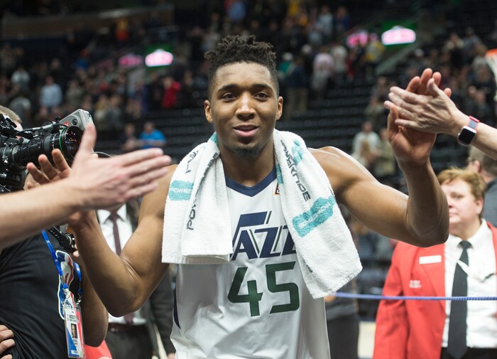 (Rick Egan  |  The Salt Lake Tribune)  Utah Jazz guard Donovan Mitchell (45) is all smiles as he heads to the locker room after the Jazz defeat the Spurs 101-99, in NBA action in Salt Lake City, Monday, February 12, 2018.