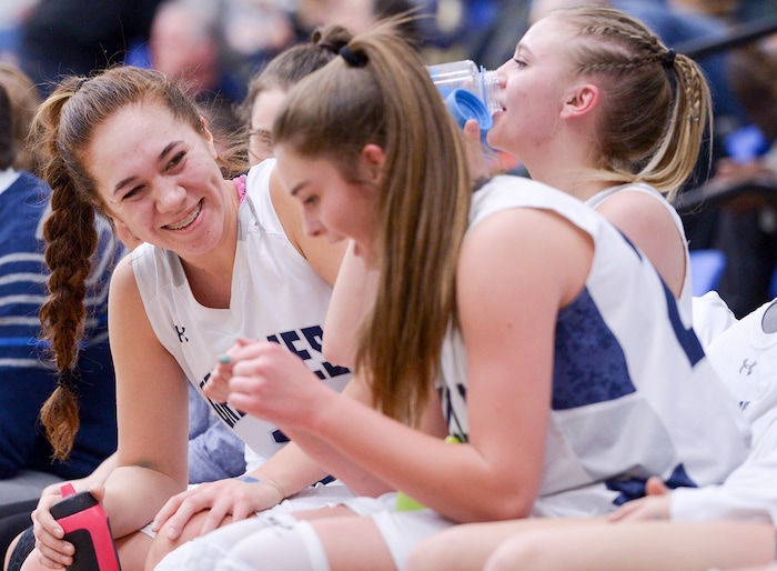 (Leah Hogsten  |  The Salt Lake Tribune)  Copper Hills' starters relax as the second string takes the court.   Copper Hills High School girls' basketball team defeated Pleasant Grove High School 66-25 during their Class 6A girls' basketball playoff opener at Salt Lake Community College Tuesday, Feb. 20, 2018. 