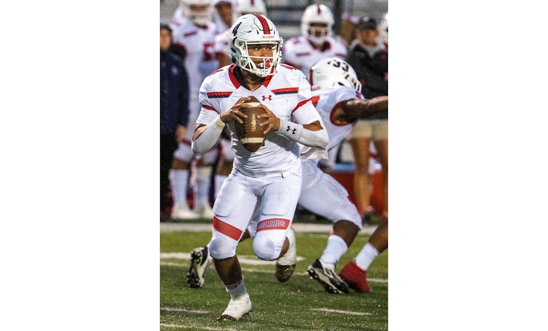 (Rick Egan | The Salt Lake Tribune) East High Quarterback Siona Vailahi (4) looks downfield, in prep football action between Corner Canyon Chargers and the East Leopards, on Saturday, Aug. 21, 2021.