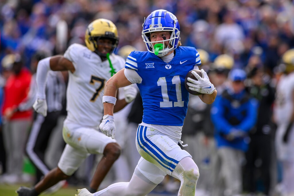 (Tyler Tate | AP) BYU wide receiver Parker Kingston (11) runs the ball in for a touchdown on Nov. 29, 2025, in Provo. Kingston was arrested this week and charged with first-degree felony rape. 