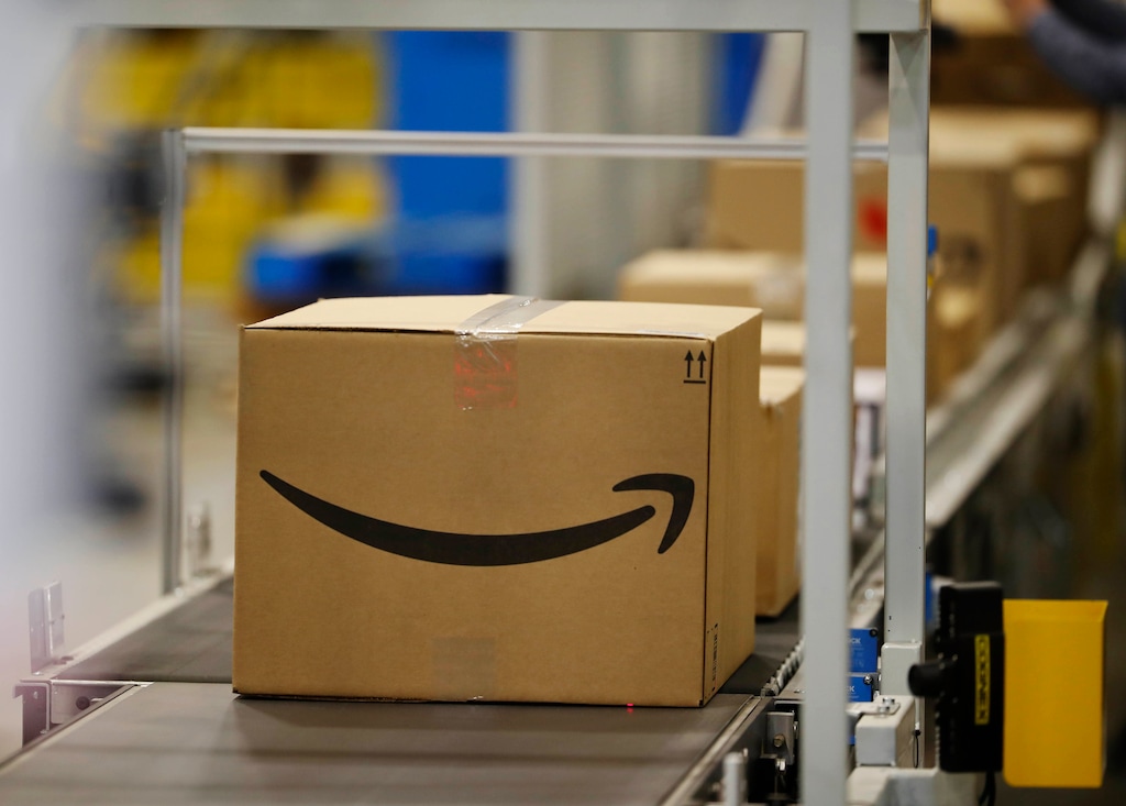(David Zalubowski | AP file photo) This May 3, 2018, file photo shows boxes on a conveyor belt during a tour of the Amazon fulfillment center in Aurora, Colo. A Utah lawmaker has moved forward a proposal to crack down on porch pirates, or people who steal packages off a front porch sometimes "almost minutes after they’re delivered.”