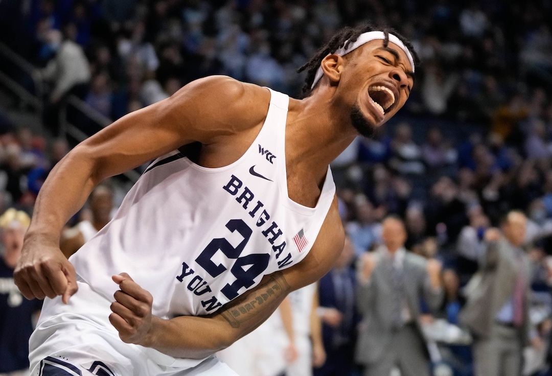 (Francisco Kjolseth | The Salt Lake Tribune) Brigham Young Cougars forward Seneca Knight (24) celebrates a dunk in the final minutes in WCC basketball action between the Brigham Young Cougars and the Portland Pilots, at the Marriott Center, on Saturday, January 22, 2022.