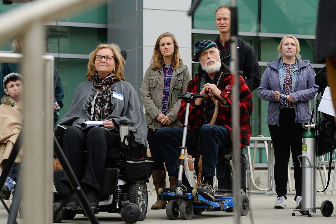 (Francisco Kjolseth  |  The Salt Lake Tribune)  A group of Utahns rally at the Wallace Bennett Federal Building in Salt Lake on Monday, Nov. 20, 2017, to tell personal stories of how they might be impacted by the tax reform plans currently on the table in Congress.