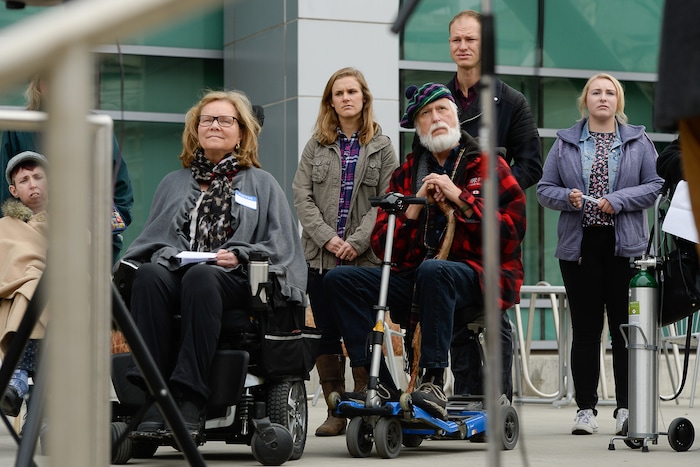 (Francisco Kjolseth  |  The Salt Lake Tribune)  A group of Utahns rally at the Wallace Bennett Federal Building in Salt Lake on Monday, Nov. 20, 2017, to tell personal stories of how they might be impacted by the tax reform plans currently on the table in Congress.