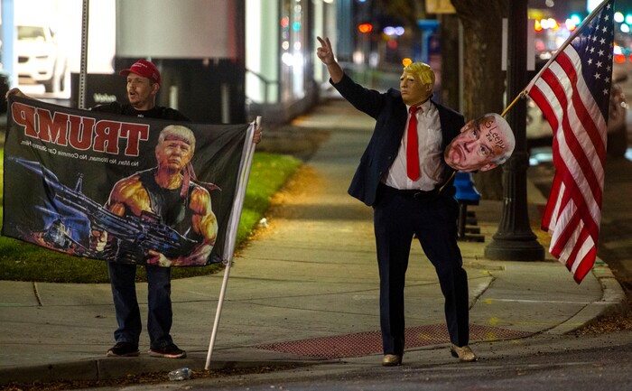 (Rick Egan | The Salt Lake Tribune)  Trump supporters, yell at cars during a rally at Washington Square, on Monday, Nov. 2, 2020.