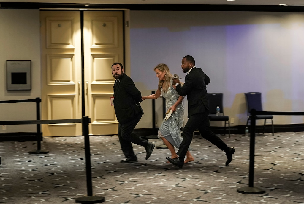 People flee after shots were fired during the 2026 White House Correspondents' Association Dinner at the Washington Hilton in Washington, on April 25, 2026. A sense of danger spread like a wave among high-profile politicians and journalists as an emergency unfolded at the White House Correspondents’ Association dinner. (Salwan Georges/The New York Times)