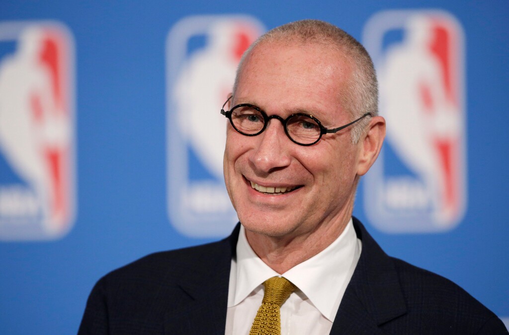 FILE - In this Oct. 6, 2014, file photo, ESPN President John Skipper smiles during a news conference in New York. The former president of ESPN says he resigned from the sports network after an extortion plot by his cocaine dealer. John Skipper told the Hollywood Reporter on Thursday, March 15, 2018, “they threatened me.” Skipper says he understood the threat put himself, his family and his professional life at risk. (AP Photo/Mark Lennihan, File)