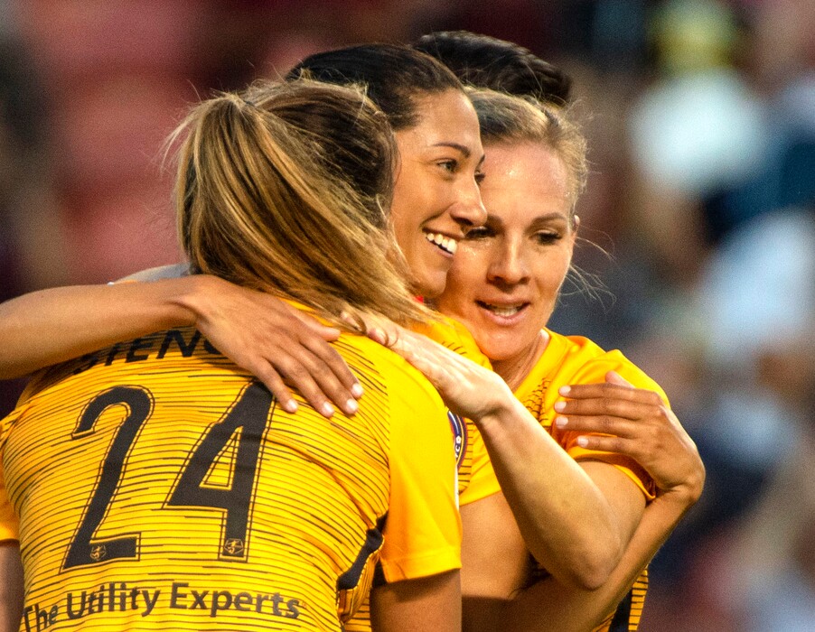 (Rick Egan  |  The Salt Lake Tribune)    Utah forward Christen Press (23) gets hugs from Utah Royals FC midfielder Utah Royals FC forward Katie Stengel (24) and Utah Royals FC forward Amy Rodriguez (8), after scoring a goal for the Royals, in Soccer action between Utah Royals FC and Portland Thorns FC, in Sandy, Friday, July 19, 2019.