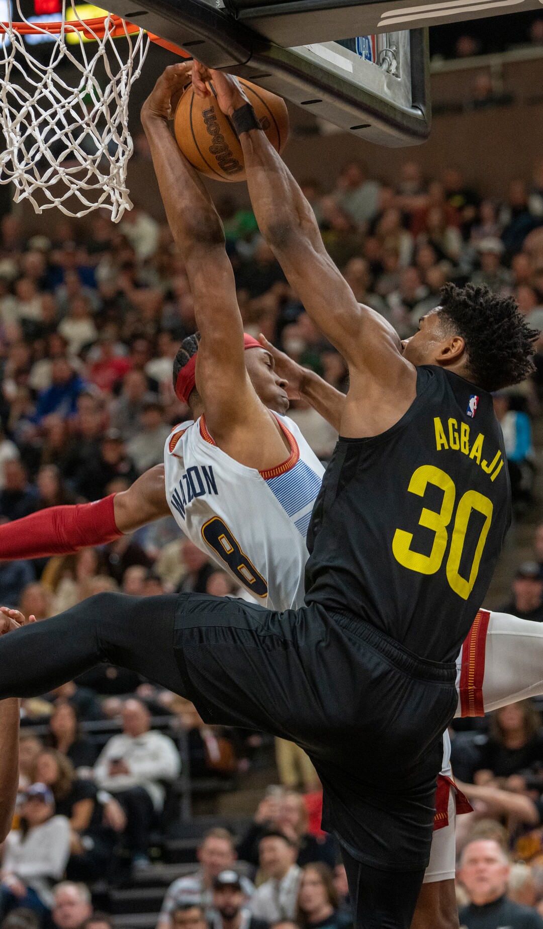 (Rick Egan | The Salt Lake Tribune) Denver Nuggets forward Peyton Watson (8) blocks a shot by Utah Jazz guard Ochai Agbaji (30), in NBA action between the Utah Jazz and the Denver Nuggets at Vivint Arena,  Saturday, April 8, 2023.