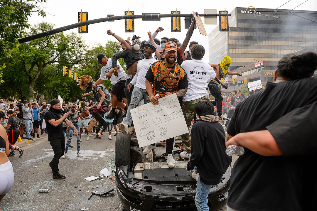 (Trent Nelson  |  The Salt Lake Tribune) A police car is destroyed and burned during a protest against police brutality in Salt Lake City on Saturday, May 30, 2020.