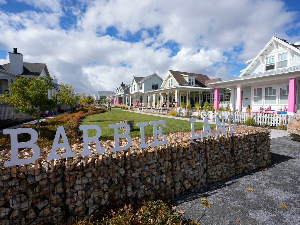 (Bethany Baker  |  The Salt Lake Tribune) A Barbieland sign stands at the end of a path in a section of Daybreak that has collectively created a Barbieland-themed community from the movie “Barbie” for Halloween on Wednesday, Oct. 11, 2023. On Oct. 20, the City of South Jordan shut down the road leading to the island to those who don't live in the community because of public safety issues.