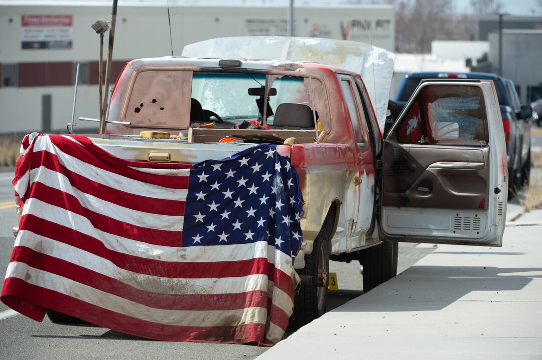 (Francisco Kjolseth  | The Salt Lake Tribune) Investigators collect evidence from a vehicle as numerous police agencies respond to a man driving erratically and claiming to have a gun and a bomb with an initial police chase ending on Center Street over Legacy Highway on Wednesday, March 17, 2021. The suspect was taken into custody.