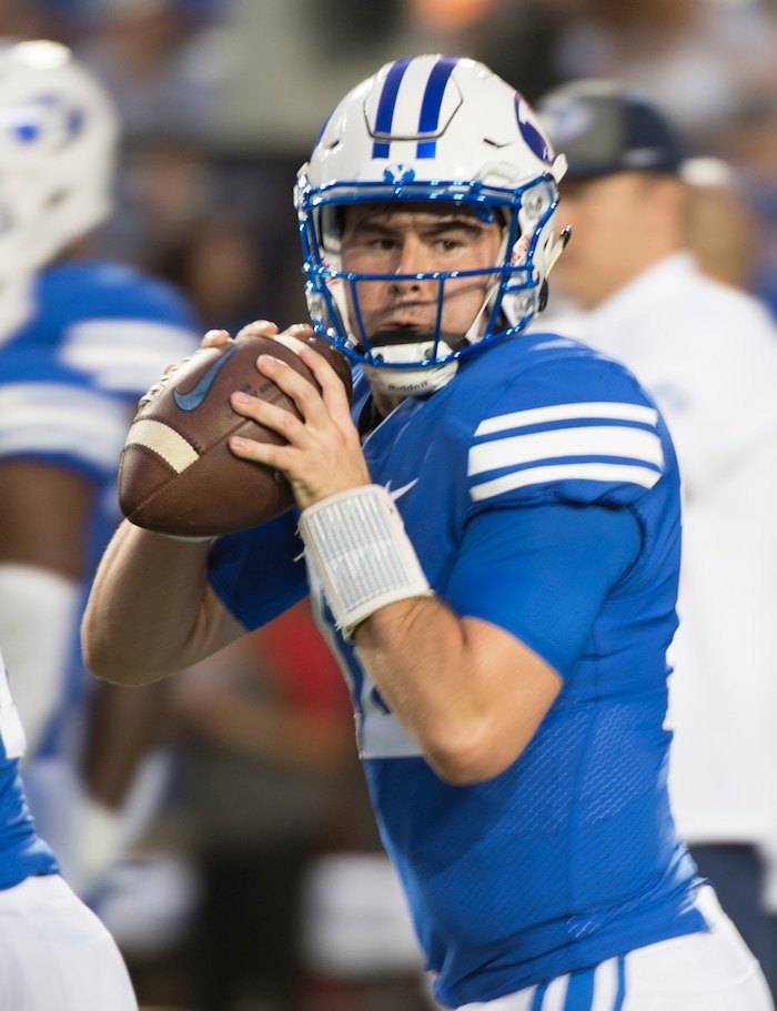 (Rick Egan  |  The Salt Lake Tribune)   Brigham Young Cougars quarterback Tanner Mangum (12) warms up before football action BYU vs Utah, at Lavell Edwards Stadium in Provo, Saturday, September 9, 2017.
