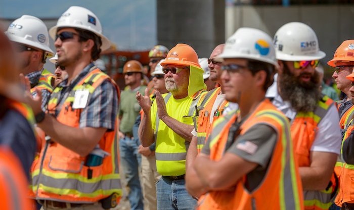 (Leah Hogsten  |  The Salt Lake Tribune) Construction workers from various trades celebrate the last steel beam on the new $485 million, 866,087 square foot, Salt Lake City International terminal building, Wednesday, May 23, 2018