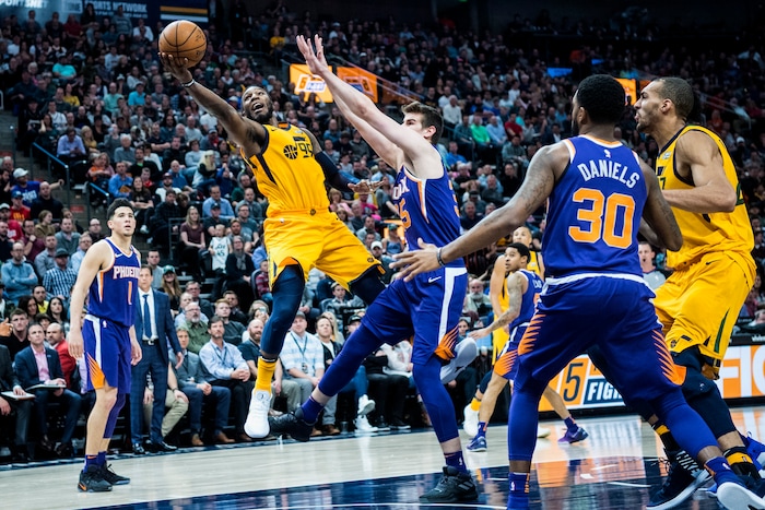 (Chris Detrick  |  The Salt Lake Tribune)  Utah Jazz forward Jae Crowder (99) shoots past Phoenix Suns forward Dragan Bender (35) during the game at Vivint Smart Home Arena Thursday, March 15, 2018. Utah Jazz defeated Phoenix Suns 116-88.