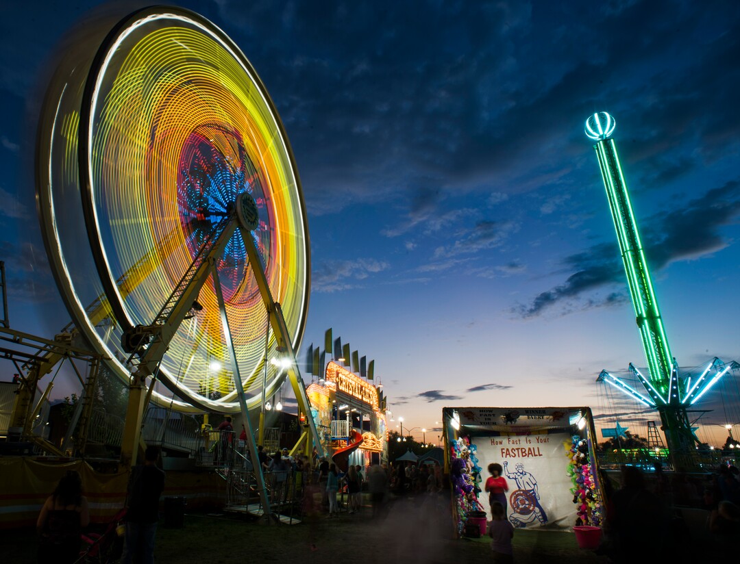 (Rick Egan  |  The Salt Lake Tribune)   The Ferris Wheel lights up the midway at the Utah State Fair, on a busy Monday,  Sept. 10, 2018.