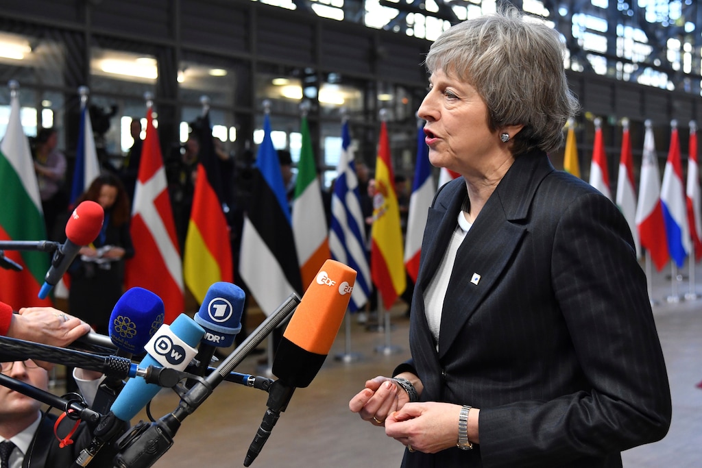 British Prime Minister Theresa May speaks with the media as she arrives for an EU summit in Brussels, Thursday, Dec. 13, 2018. EU leaders gather for a two-day summit, beginning Thursday, which will center on the Brexit negotiations. (AP Photo/Geert Vanden Wijngaert)