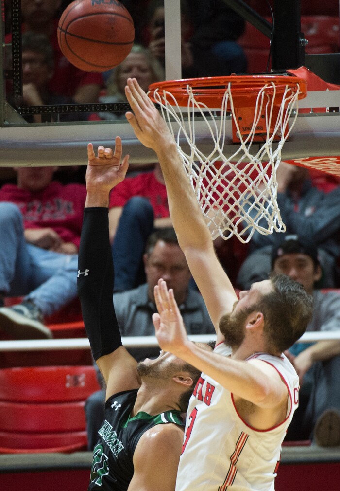 (Rick Egan  |  The Salt Lake Tribune)  Utah Utes forward David Collette (13), blocks a shot by Hawaii Warriors forward Gibson Johnson (21)  in basketball action, Utah Utes vs Hawaii Warriors, at the Jon M. Huntsman Center, Saturday, December 2, 2017.