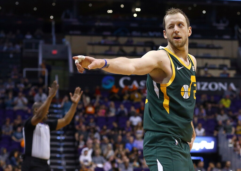 Utah Jazz forward Joe Ingles winks at Jazz fans in the front row after making a 3-pointer against the Phoenix Suns during the second half of an NBA basketball Wednesday, April 3, 2019, in Phoenix. The Jazz won 118-97. (AP Photo/Ross D. Franklin)