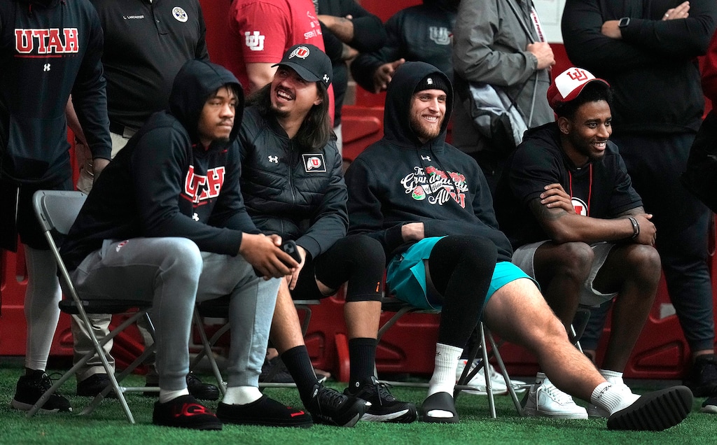 (Leah Hogsten | The Salt Lake Tribune)  University of Utah tight end Brant Kuithe second from right, shares a laugh with quarterback Cam Rising at Utah Pro Day Thursday at the Eccles Field House, March 23, 2023.