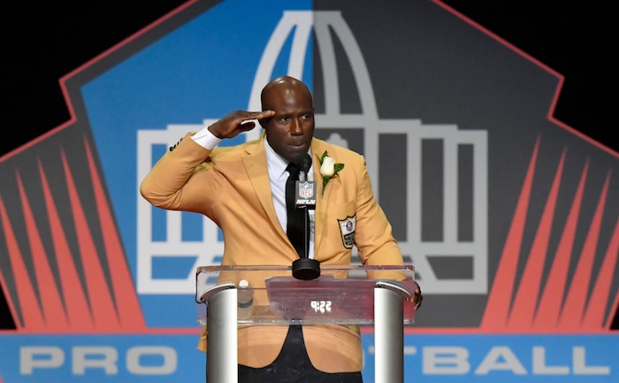 Former NFL player Terrell Davis salutes as he delivers his speech during an induction ceremony at the Pro Football Hall of Fame, Saturday, Aug. 5, 2017, in Canton, Ohio. (AP Photo/David Richard)