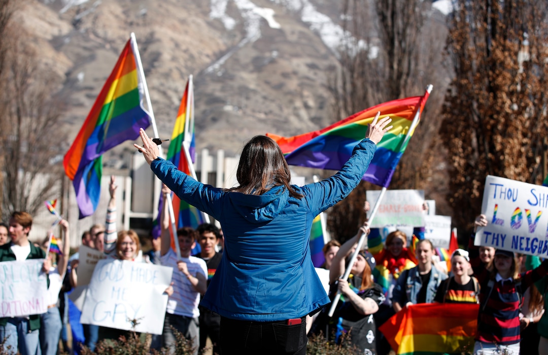 (George Frey  |  special to The Salt Lake Tribune) BYU students and others gather in front of the Ernest L. Wilkinson Student Center on the campus of Brigham Young University to protest BYUÕs rollback of a newly announced policy change on LGBTQ students on March 5, 2020 in Provo, Utah.