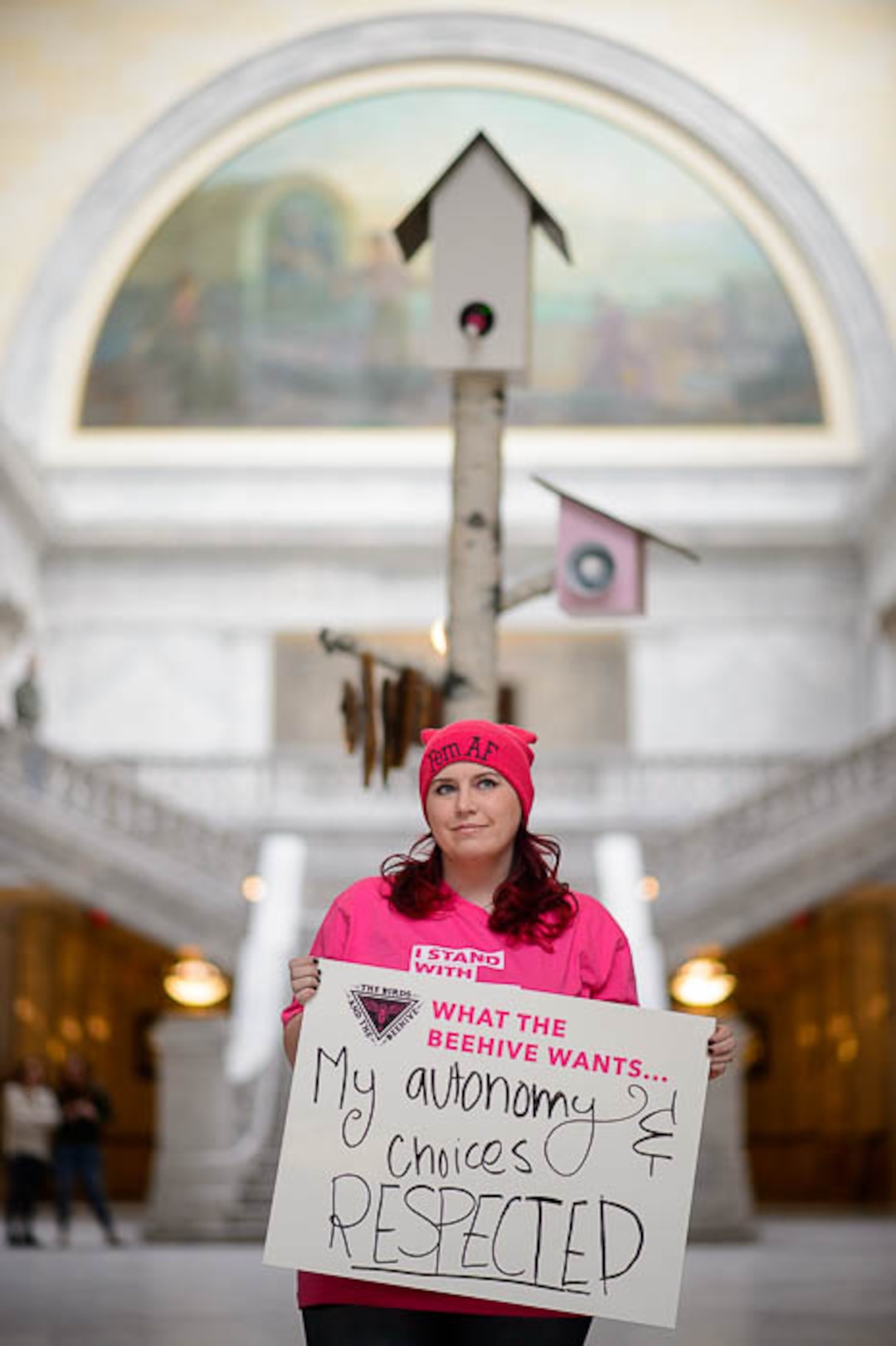 (Trent Nelson | The Salt Lake Tribune)  Kat Long and other supporters of Planned Parenthood Association of Utah gathered in a silent protest in the Utah State Capitol Rotunda Friday March 1, 2019, while a 12-foot birdhouse art installation broadcast statements from Utah constituents.