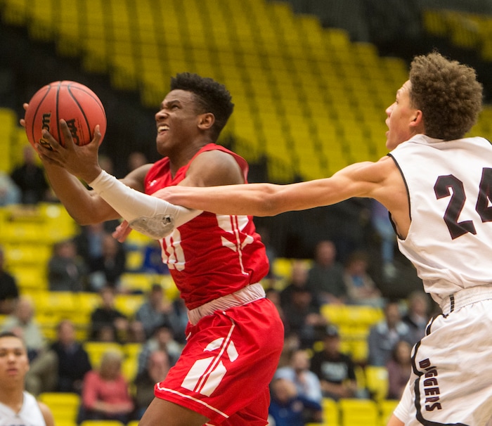 (Rick Egan  |  The Salt Lake Tribune)   Jordan Beatdiggeros, Jordan Mosley stops East Leopards Jaylon Vickers (10) in 5A basketball playoff action between the East Leopards and the Jordan Beatdiggers at the UCCU Center in Orem, Monday, Feb. 26, 2018.