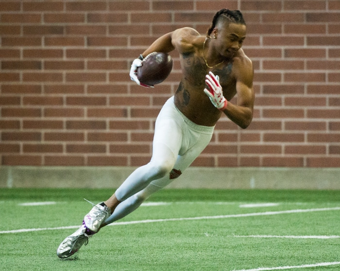(Rick Egan  |  The Salt Lake Tribune)      Darren Carrington II, runs with the ball, as he catches a pass from Troy Williams during University of Utah's 2018 Pro Day for NFL scouts, at Spence Eccles Field House, Wednesday, March 28, 2018.