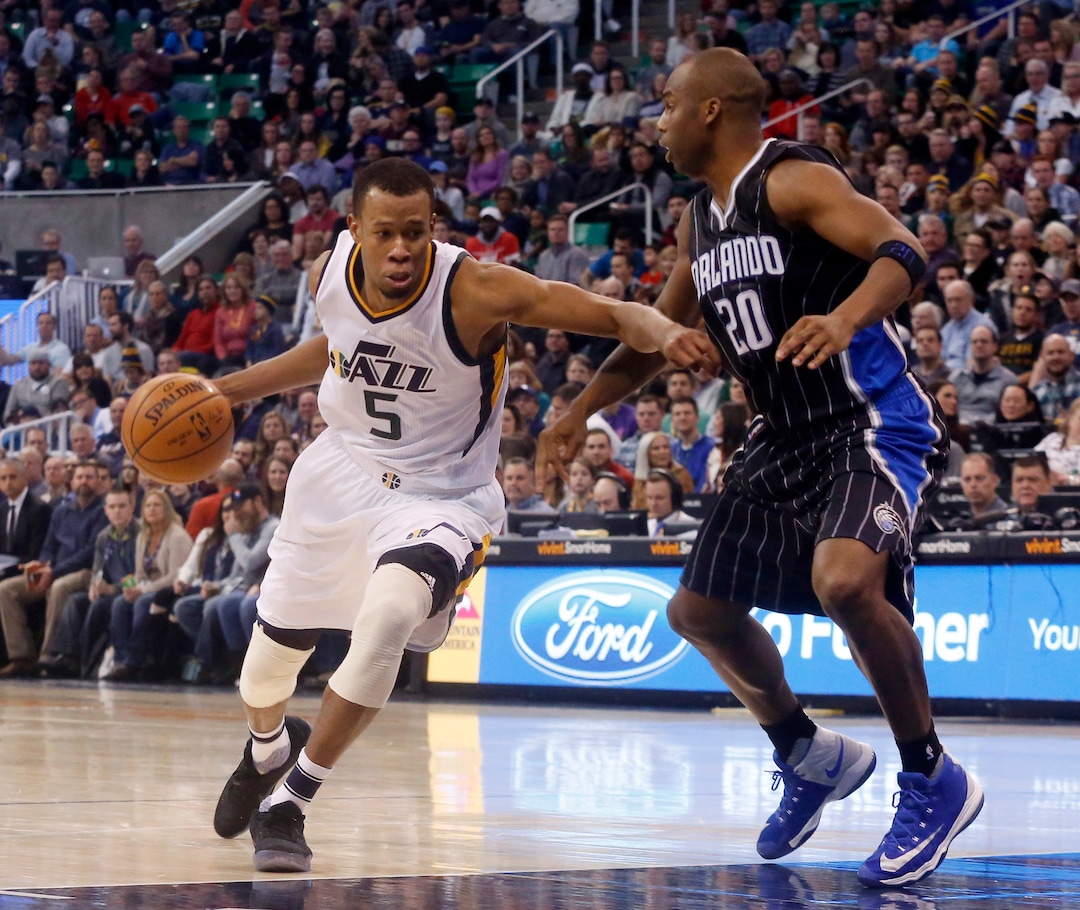 Utah Jazz's Rodney Hood (5) dribbles past Orlando Magic's Jodie Meeks (20) during the second half of an NBA basketball game Saturday, Jan. 14, 2017, in Salt Lake City. The Jazz won 114-107. (AP Photo/Kim Raff)