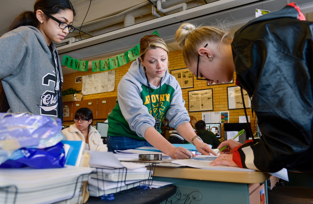 (Leah Hogsten  |  The Salt Lake Tribune) Journalism instructor Kathryn Wilkins helps copy editor Kadie Gorman, right, as senior staff writer Oyuki Garcia waits to speak with Wilkins Nov. 26.