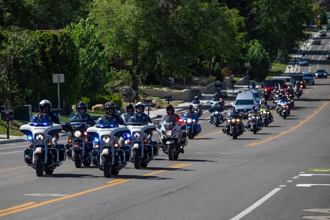 (Ben Dorger | Standard-Examiner via AP) The funeral procession of Army Sgt. 1st Class Elliott Robbins on Thursday, July 18, 2019, on Harrison Boulevard en route to St. James Catholic Church in Ogden. Robbins died in a non-combat incident on June 30 while serving in Afghanistan.
