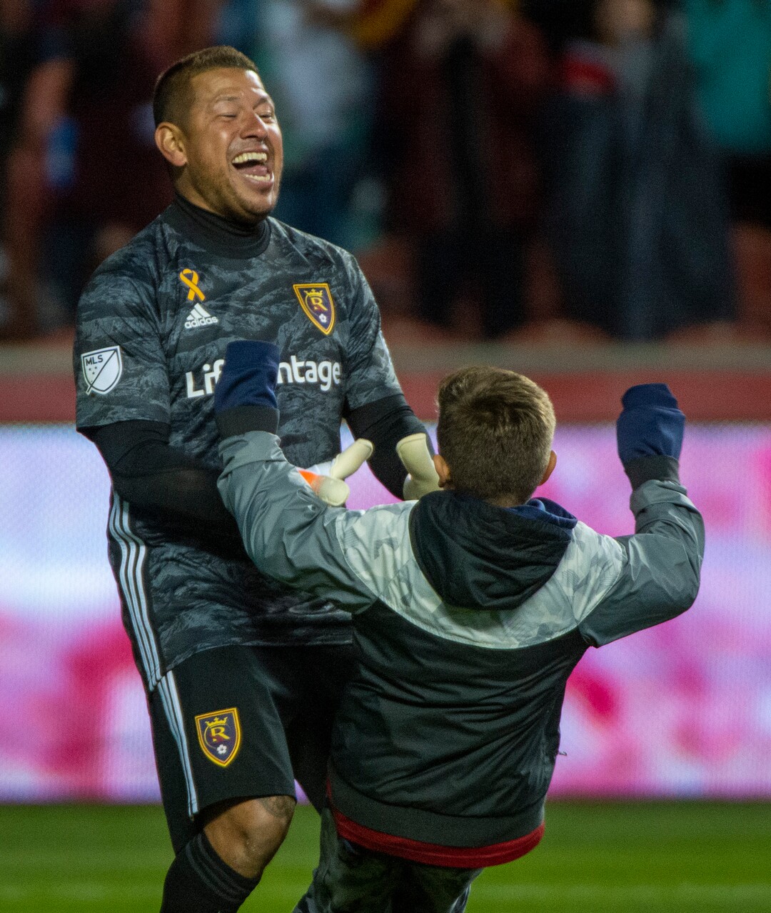 (Rick Egan  |  The Salt Lake Tribune)      Jett Rimando rushes out to congratulate his dad, as Real Salt Lake goalkeeper Nick Rimando (18) as Real Salt Lake defeats the Houston Dynamo 2-1 in his last regular season home game, in MLS soccer action, at Rio Tinto Stadium, Sunday, Sept. 29, 2019.