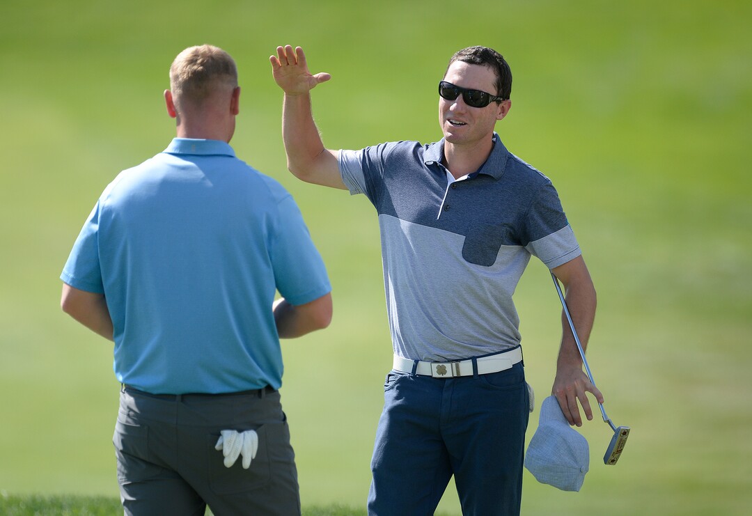(Scott Sommerdorf   |  The Salt Lake Tribune)   Eddie Olson congratulates Patrick Fishburn, left, who won the Utah Open golf tournament played at the Riverside Country Club, Sunday, August 27, 2017. Fishburn crushed the field, with a 26 under score, nine strokes ahead of second place finisher Zahkai Brown at -17.