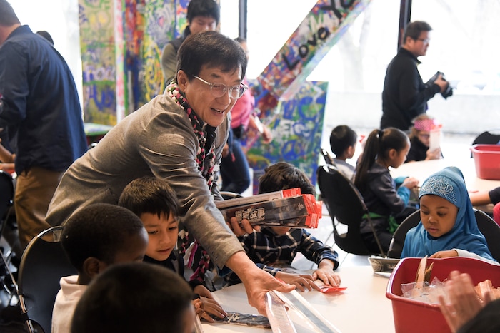 (Francisco Kjolseth | The Salt Lake Tribune) Jackie Chan meets with Mountain View Elementary students as he hands out rulers with an embedded strip of recycled film from one of his movies making every one unique during a workshop as part of a preview of Jackie ChanÕs Inaugural Environmental Exhibition ÔJackie Chan: Green HeroÕ at The Leonardo: Museum of Creativity and Innovation on Thursday, Jan. 24, 2019.