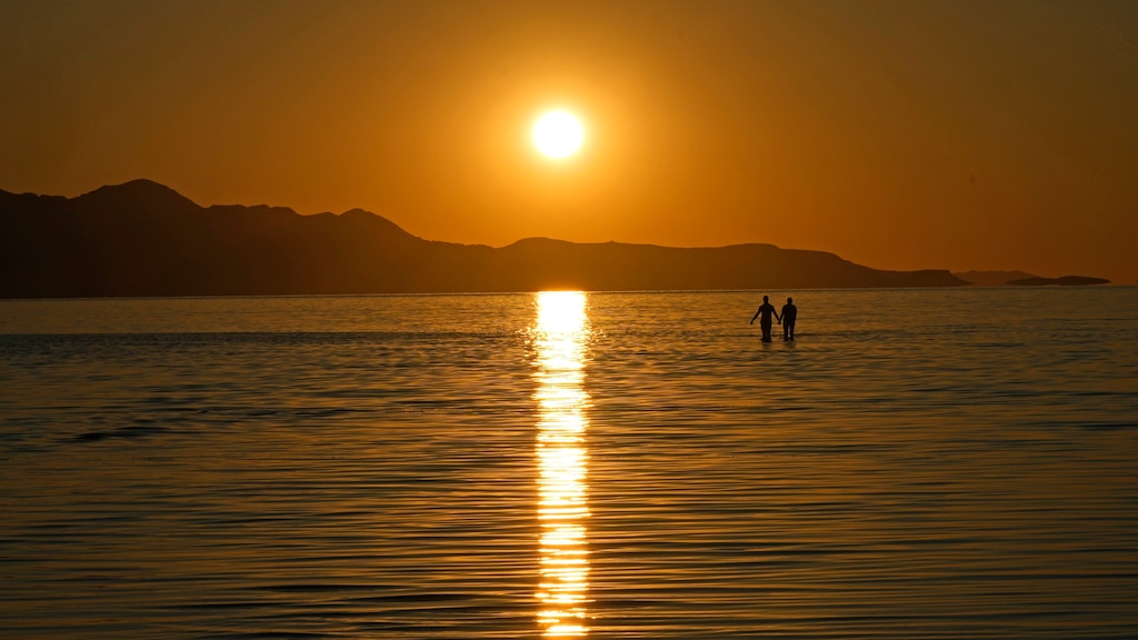(Rick Bowmer | The Associated Press) The sun sets on the Great Salt Lake on June 15, 2023, near Magna, Utah.